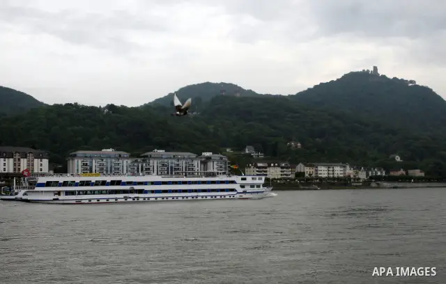Ships in the River Rhine near the city of Bonn in Germany on 15 June 2012. The Rhine is one of the longest and most important rivers in Europe. It runs for over 1,232 km .Rhine flows through six countries -Switzerland, P...