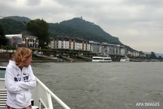 Ships in the River Rhine near the city of Bonn in Germany on 15 June 2012. The Rhine is one of the longest and most important rivers in Europe. It runs for over 1,232 km .Rhine flows through six countries -Switzerland, P...