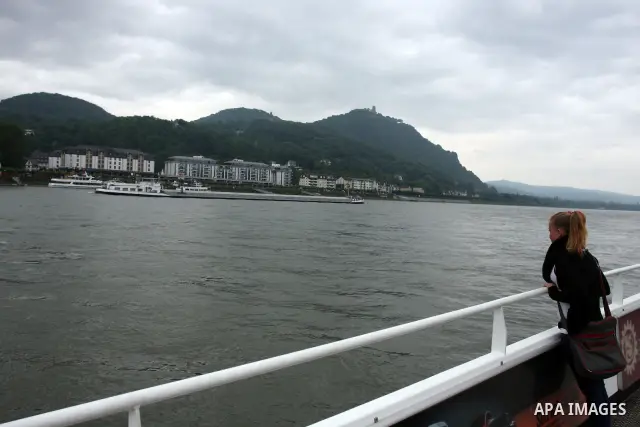 Ships in the River Rhine near the city of Bonn in Germany on 15 June 2012. The Rhine is one of the longest and most important rivers in Europe. It runs for over 1,232 km .Rhine flows through six countries -Switzerland, P...