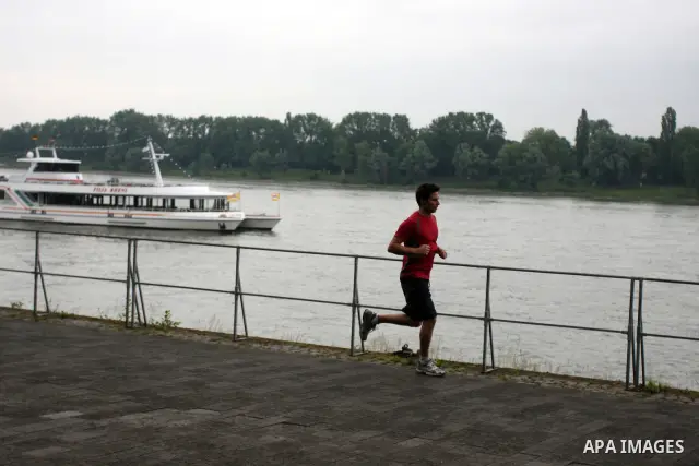 A German runs near the river Rhine near the city of Bonn in Germany on 15 June 2012. The Rhine is one of the longest and most important rivers in Europe. It runs for over 1,232 km .Rhine flows through six countries -Swit...