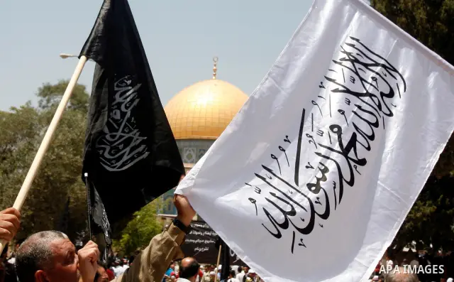 Dozens of members of the Islamic Liberation Movement, take part in a rally to mark anniversary of the overthrow of the Islamic Caliphate at Al-Aqsa Mosque following the friday prayers in the Jerusalem old city on 15 June...