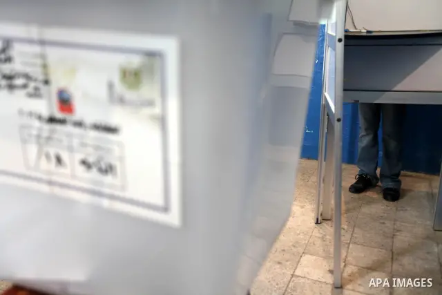 An Egyptian woman casts her vote at a polling station in Cairo on June 16, 2012 in a divisive presidential runoff pitting ousted strongman Hosni Mubarak's last premier Ahmed Shafiq against Muslim Brotherhood candidate Mo...