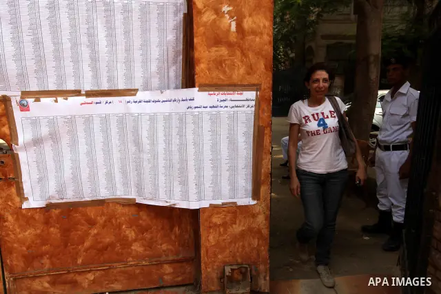 A voter checks her name at a polling station in Cairo June 16, 2012. Egypt's first free presidential election concludes this weekend in a run-off between the Muslim Brotherhood's candidate Mohamed Morsy and Ahmed Shafik,...