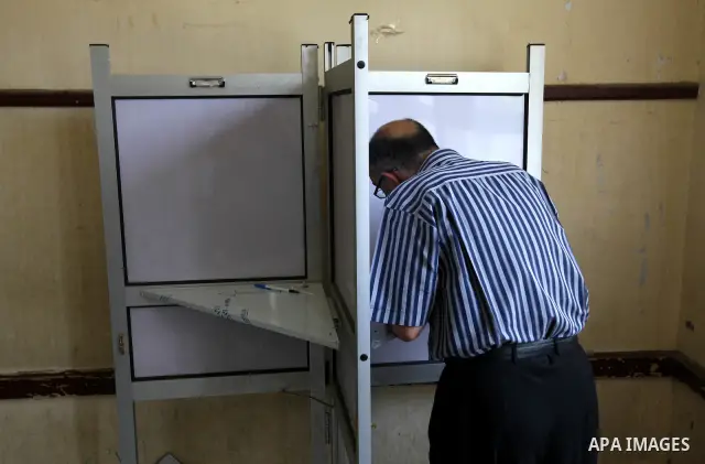 An Egyptian man casts their vote at a polling station in Cairo on June 16, 2012 in a divisive presidential runoff pitting ousted strongman Hosni Mubarak's last premier Ahmed Shafiq against Muslim Brotherhood candidate Mo...