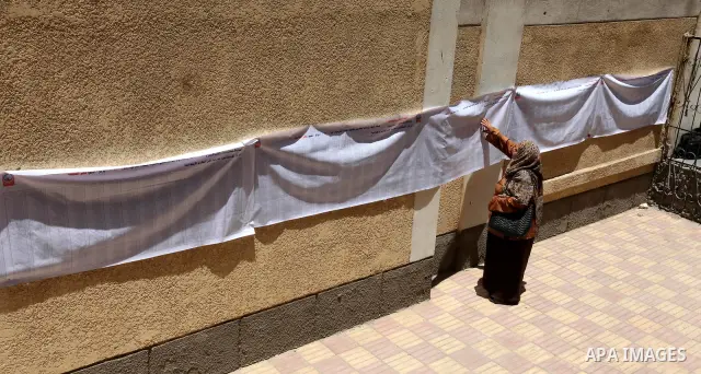 A voter checks her name at a polling station in Cairo June 16, 2012. Egypt's first free presidential election concludes this weekend in a run-off between the Muslim Brotherhood's candidate Mohamed Morsy and Ahmed Shafik,...