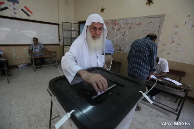 An Egyptian man casts his ballot in the second round of the historical presidential election at polling station in Cairo on June 16, 2012. Egyptians were voting in a run-off presidential election pitting an Islamist agai...