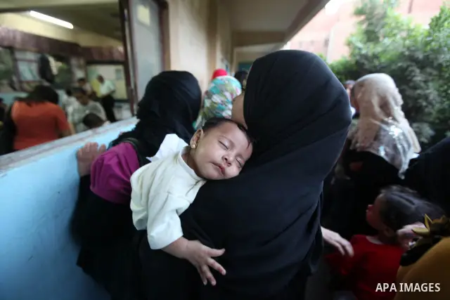 Egyptian women gather to cast their vote in Cairo on June 16, 2012. Egyptians were voting in a run-off presidential election pitting an Islamist against Hosni Mubarak's last premier amid political chaos highlighted by un...