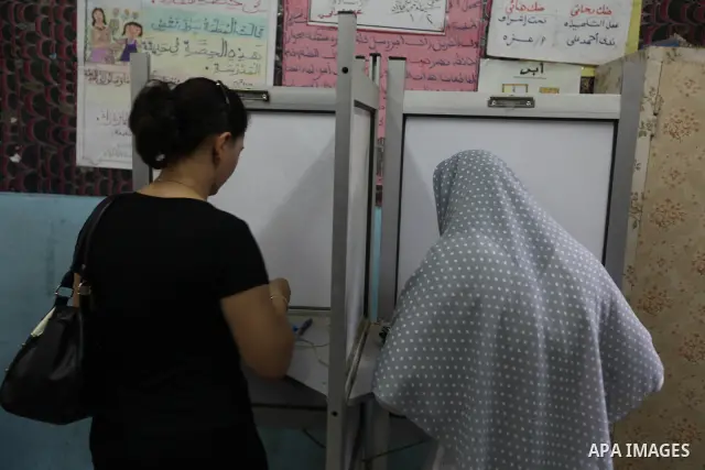 Egyptian women vote at a polling station in Cairo, Egypt on Saturday, June 16, 2012. Egyptians voted Saturday in the country's landmark presidential runoff, choosing between Hosni Mubarak's ex-prime minister and an Islam...