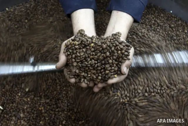 A Palestinian man makes coffe a factory in the West Bank city of Nablus on June 17, 2012. Nablus is famous of manufacturing several different types of spices. Photo by Nedal Eshtayah