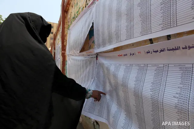 Voters check for their names before casting their votes during the second day of voting in Egypt's presidential election at a polling station in Cairo June 17, 2012. A second day of voting on Sunday will deliver Egypt's...