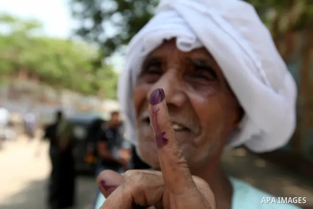 An Egyptian man shows his ink-stained finger after voting at a polling station in Cairo on June 17, 2012 on Egypt's final day of a divisive election to choose a successor to ousted president Hosni Mubarak, in a race that...