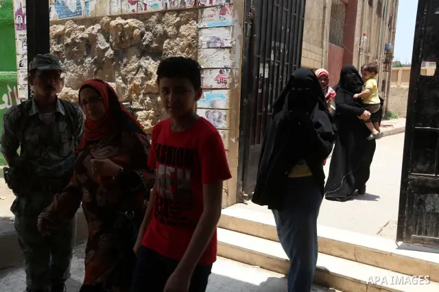 Voter out from a polling station after casting their vote during the second day of voting in Egypt's presidential election in Cairo June 17, 2012. A second day of voting on Sunday will deliver Egypt's first freely electe...
