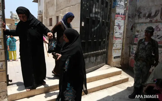 Voter out from a polling station after casting their vote during the second day of voting in Egypt's presidential election in Cairo June 17, 2012. A second day of voting on Sunday will deliver Egypt's first freely electe...