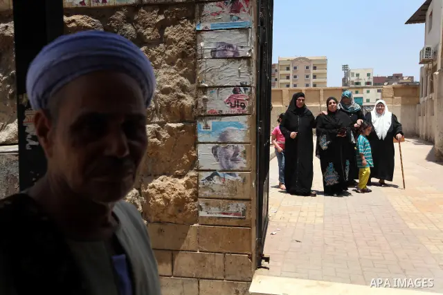 Voter out from a polling station after casting their vote during the second day of voting in Egypt's presidential election in Cairo June 17, 2012. A second day of voting on Sunday will deliver Egypt's first freely electe...