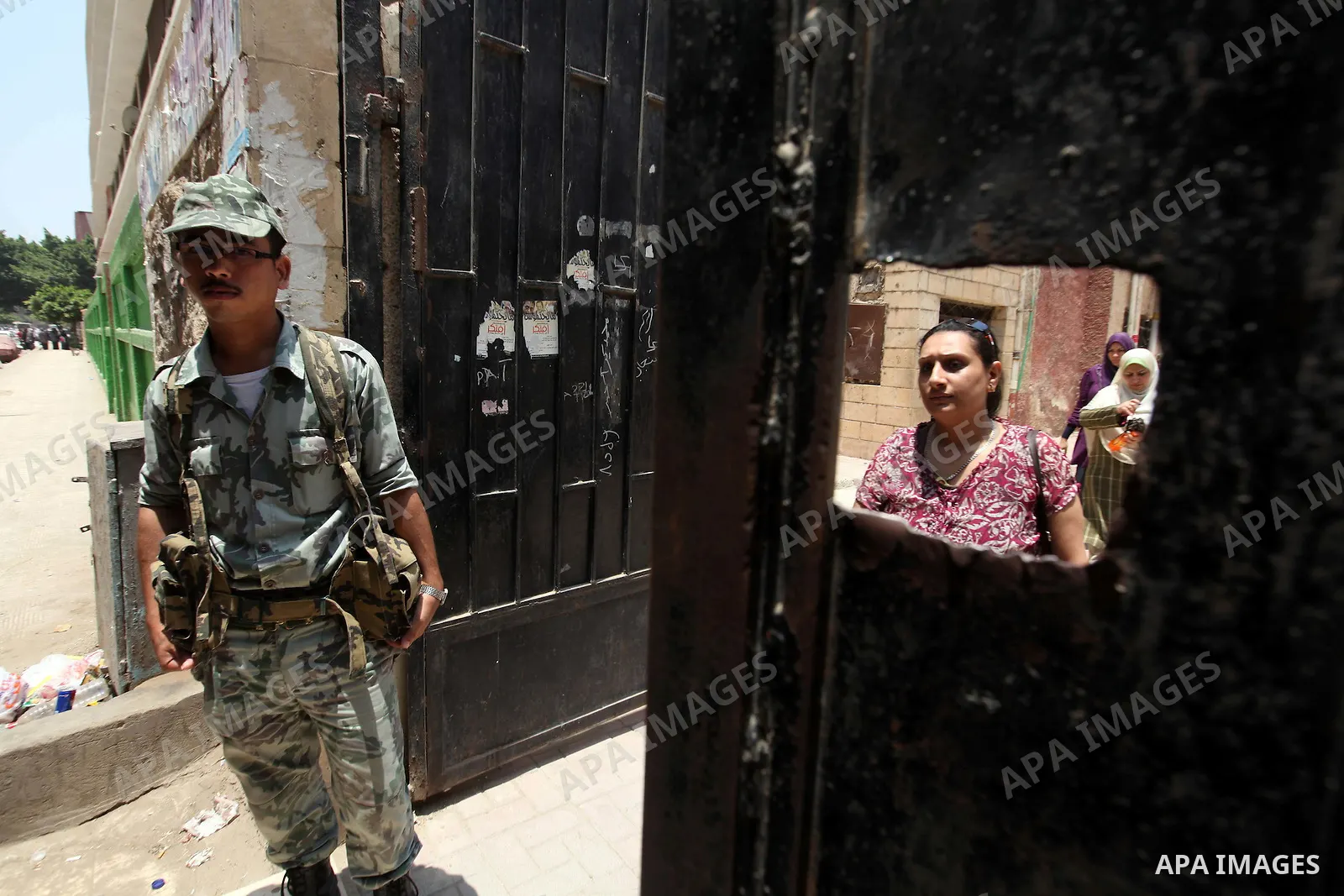 Voter out from a polling station after casting their vote during the second day of voting in Egypt's presidential election in Cairo June 17, 2012. A second day of voting on Sunday will deliver Egypt's first freely electe...