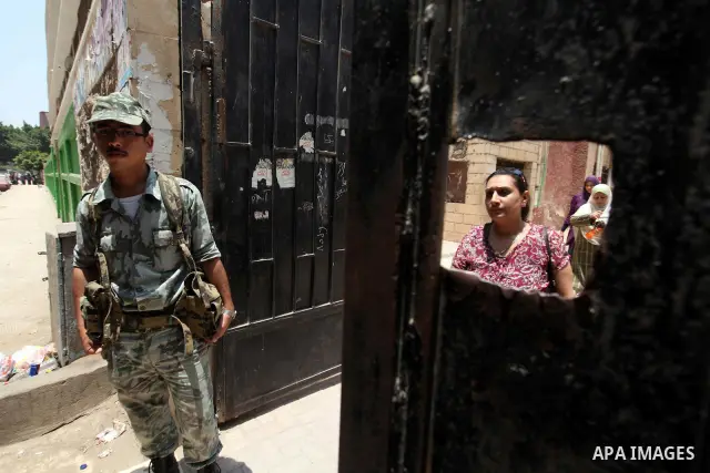Voter out from a polling station after casting their vote during the second day of voting in Egypt's presidential election in Cairo June 17, 2012. A second day of voting on Sunday will deliver Egypt's first freely electe...