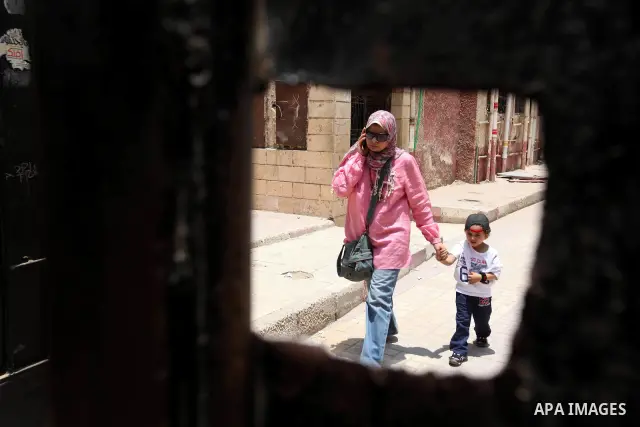 Voter out from a polling station after casting their vote during the second day of voting in Egypt's presidential election in Cairo June 17, 2012. A second day of voting on Sunday will deliver Egypt's first freely electe...