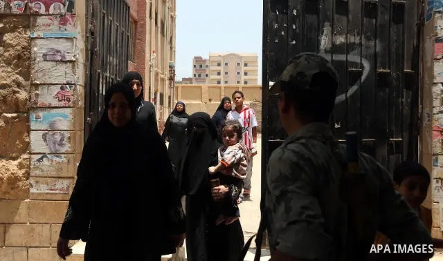 Voter out from a polling station after casting their vote during the second day of voting in Egypt's presidential election in Cairo June 17, 2012. A second day of voting on Sunday will deliver Egypt's first freely electe...