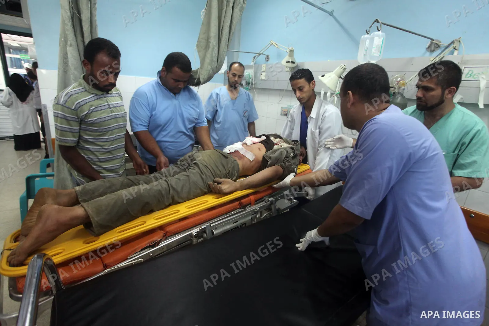 Palestinian medics treat a wounded Palestinian man at al Aqsa hospital in the central Gaza Strip town of Deir Al Balah, on 17 June 2012. Israeli forces opened fire after incursion Gaza east border about 300 meters. Photo...
