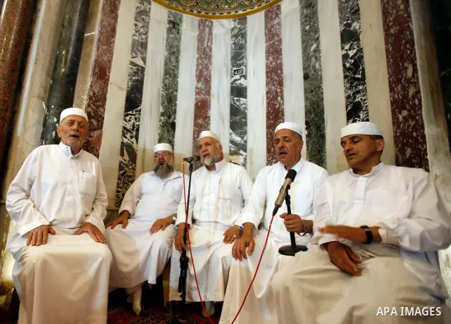 Islamic Singing choir take part in a celebration of the Islamic holiday of Isra Mi'raj in the Al-Aqsa mosque, in the Jerusalem old city, on June 17, 2012. The holiday marks what Muslims believe is Prophet Mohammad's jour...