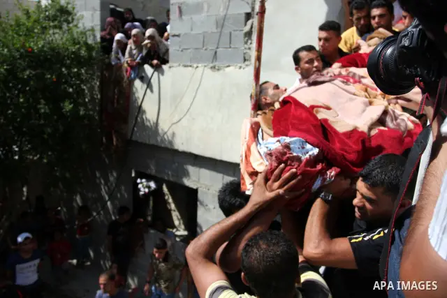 Palestinians carry the dead body of Naim al-Najar during his funeral in the West Bank village of Idhna, near Hebron, Sunday, June 17, 2012. An Israeli tow truck driver shot dead two Palestinians and wounded one Sunday du...