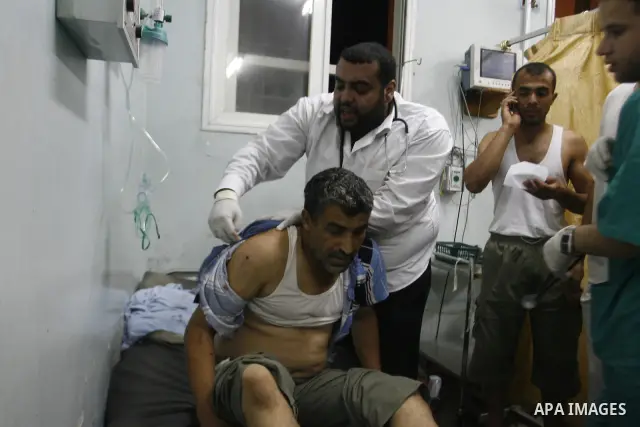 A Palestinian man wounded by Israeli air strikes on the southern Gaza Strip lays in a hospital bed, at the al-Najar hospital in Rafah, on June 18, 2012. Five Palestinians were wounded in the night between June 17 and 18...