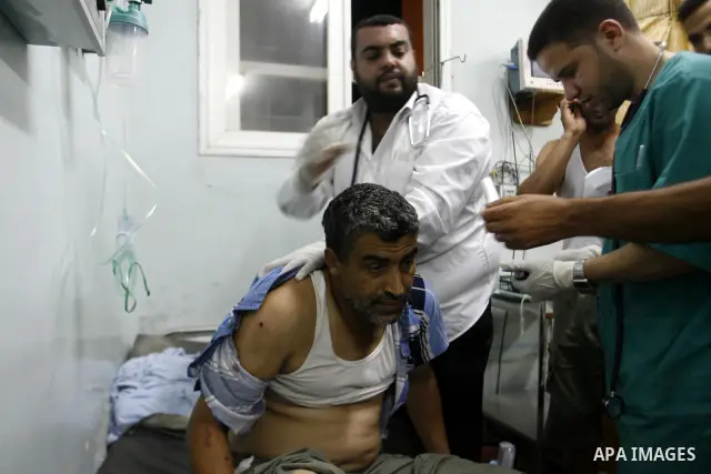 A Palestinian man wounded by Israeli air strikes on the southern Gaza Strip lays in a hospital bed, at the al-Najar hospital in Rafah, on June 18, 2012. Five Palestinians were wounded in the night between June 17 and 18...
