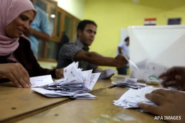 Electoral workers count ballots during the second day of voting in Egypt's presidential election, at a polling station in Cairo June 17, 2012. Egyptians began an anxious wait for their first freely elected president on S...