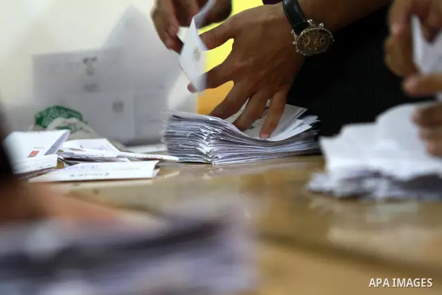 Electoral workers count ballots during the second day of voting in Egypt's presidential election, at a polling station in Cairo June 17, 2012. Egyptians began an anxious wait for their first freely elected president on S...