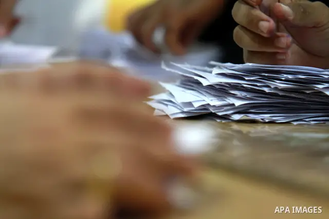 Electoral workers count ballots during the second day of voting in Egypt's presidential election, at a polling station in Cairo June 17, 2012. Egyptians began an anxious wait for their first freely elected president on S...