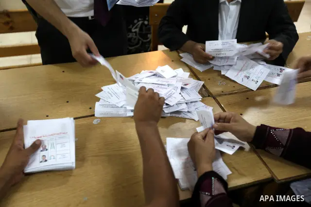 Electoral workers count ballots during the second day of voting in Egypt's presidential election, at a polling station in Cairo June 17, 2012. Egyptians began an anxious wait for their first freely elected president on S...