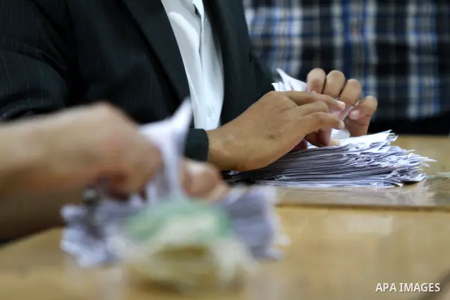 Electoral workers count ballots during the second day of voting in Egypt's presidential election, at a polling station in Cairo June 17, 2012. Egyptians began an anxious wait for their first freely elected president on S...