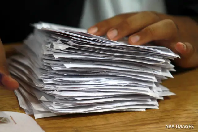 Electoral workers count ballots during the second day of voting in Egypt's presidential election, at a polling station in Cairo June 17, 2012. Egyptians began an anxious wait for their first freely elected president on S...