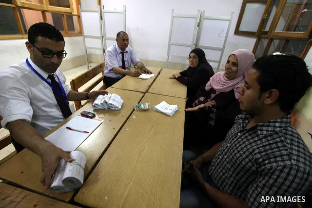 Electoral workers count ballots during the second day of voting in Egypt's presidential election, at a polling station in Cairo June 17, 2012. Egyptians began an anxious wait for their first freely elected president on S...