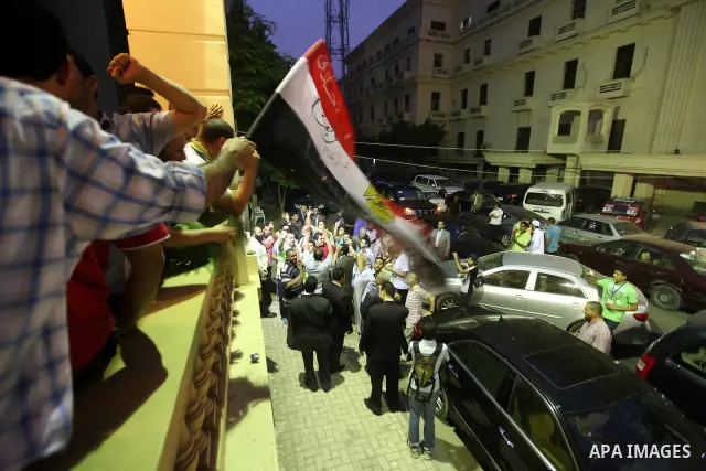 Supporters of Egypt's Muslim Brotherhood candidate Mohammed Mursi celebrate after the announcement of presidential election results in Cairo on June 18, 2012. The campaign of Egyptian presidential candidate Ahmed Shafiq...