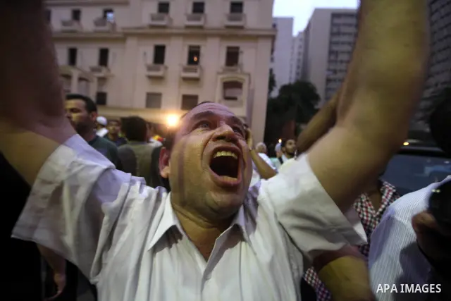 Supporters of Egypt's Muslim Brotherhood candidate Mohammed Mursi celebrate after the announcement of presidential election results in Cairo on June 18, 2012. The campaign of Egyptian presidential candidate Ahmed Shafiq...