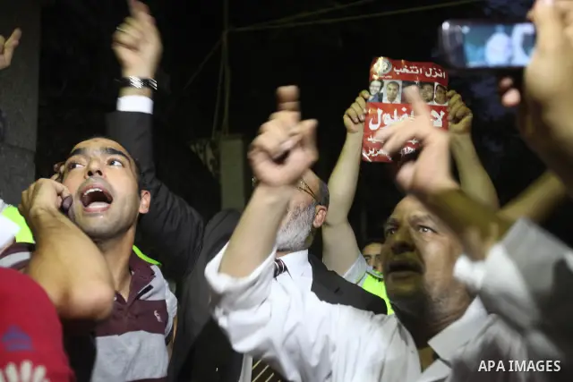 Supporters of Egypt's Muslim Brotherhood candidate Mohammed Mursi celebrate after the announcement of presidential election results in Cairo on June 18, 2012. The campaign of Egyptian presidential candidate Ahmed Shafiq...