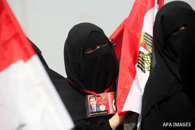 Supporters of presidential candidate Mohammed Morsi carry Egyptian and Muslim Brotherhood flags during celebrations claiming victory in Tahrir Square, Cairo, Egypt, Monday, June 18, 2012. The Muslim Brotherhood declared...