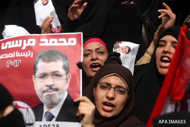 Supporters of presidential candidate Mohammed Morsi carry Egyptian and Muslim Brotherhood flags during celebrations claiming victory in Tahrir Square, Cairo, Egypt, Monday, June 18, 2012. The Muslim Brotherhood declared...