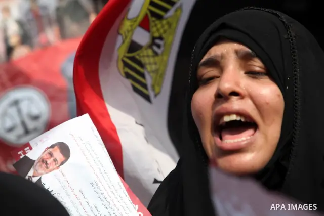 Supporters of presidential candidate Mohammed Morsi carry Egyptian and Muslim Brotherhood flags during celebrations claiming victory in Tahrir Square, Cairo, Egypt, Monday, June 18, 2012. The Muslim Brotherhood declared...