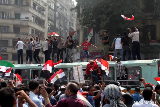Supporters of Egypt's Muslim Brotherhood candidate Mohammed Morsi celebrate in Tahrir square after the Brotherhood claimed win in presidential vote, in Cairo, Egypt, 18 June 2012. Hundreds of Muslim Brotherhood supporter...