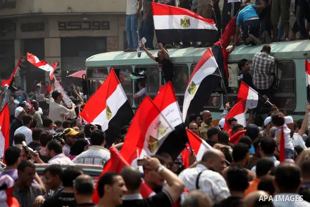 Supporters of Egypt's Muslim Brotherhood candidate Mohammed Morsi celebrate in Tahrir square after the Brotherhood claimed win in presidential vote, in Cairo, Egypt, 18 June 2012. Hundreds of Muslim Brotherhood supporter...