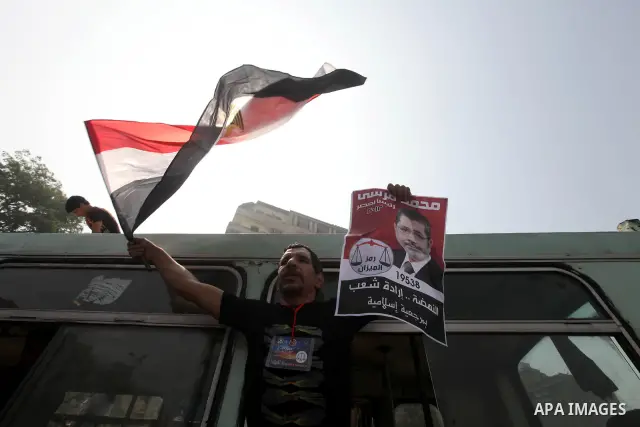 Supporters of Egypt's Muslim Brotherhood candidate Mohammed Morsi celebrate in Tahrir square after the Brotherhood claimed win in presidential vote, in Cairo, Egypt, 18 June 2012. Hundreds of Muslim Brotherhood supporter...