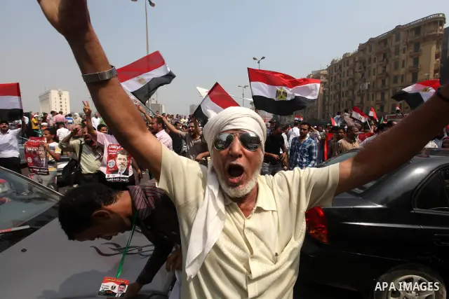 Supporters of Egypt's Muslim Brotherhood candidate Mohammed Morsi celebrate in Tahrir square after the Brotherhood claimed win in presidential vote, in Cairo, Egypt, 18 June 2012. Hundreds of Muslim Brotherhood supporter...