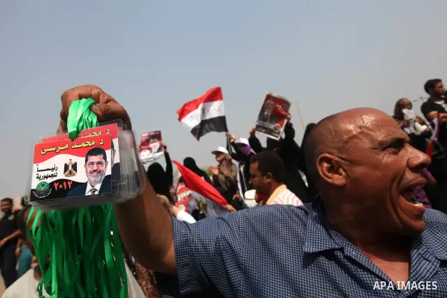 Supporters of Egypt's Muslim Brotherhood candidate Mohammed Morsi celebrate in Tahrir square after the Brotherhood claimed win in presidential vote, in Cairo, Egypt, 18 June 2012. Hundreds of Muslim Brotherhood supporter...