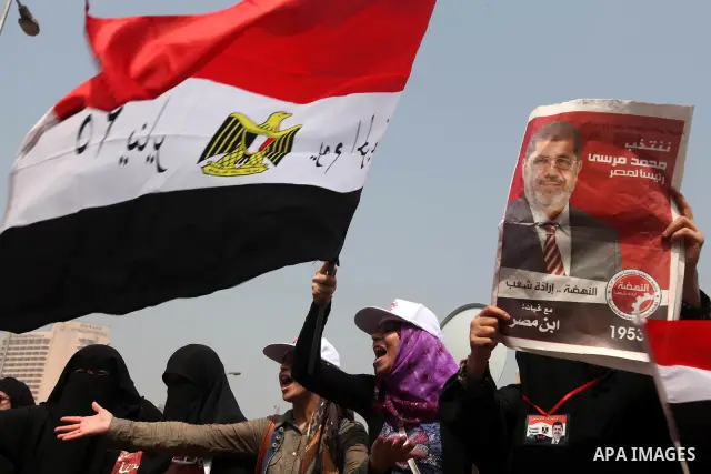Supporters of Egypt's Muslim Brotherhood candidate Mohammed Morsi celebrate in Tahrir square after the Brotherhood claimed win in presidential vote, in Cairo, Egypt, 18 June 2012. Hundreds of Muslim Brotherhood supporter...
