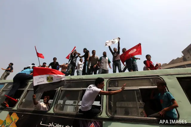 Supporters of Egypt's Muslim Brotherhood candidate Mohammed Morsi celebrate in Tahrir square after the Brotherhood claimed win in presidential vote, in Cairo, Egypt, 18 June 2012. Hundreds of Muslim Brotherhood supporter...