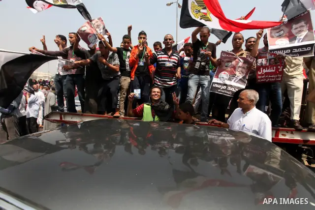 Supporters of Egypt's Muslim Brotherhood candidate Mohammed Morsi celebrate in Tahrir square after the Brotherhood claimed win in presidential vote, in Cairo, Egypt, 18 June 2012. Hundreds of Muslim Brotherhood supporter...