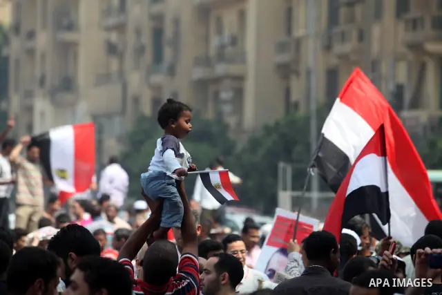 Supporters of Egypt's Muslim Brotherhood candidate Mohammed Morsi celebrate in Tahrir square after the Brotherhood claimed win in presidential vote, in Cairo, Egypt, 18 June 2012. Hundreds of Muslim Brotherhood supporter...