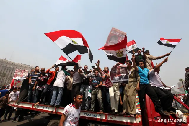 Supporters of Egypt's Muslim Brotherhood candidate Mohammed Morsi celebrate in Tahrir square after the Brotherhood claimed win in presidential vote, in Cairo, Egypt, 18 June 2012. Hundreds of Muslim Brotherhood supporter...
